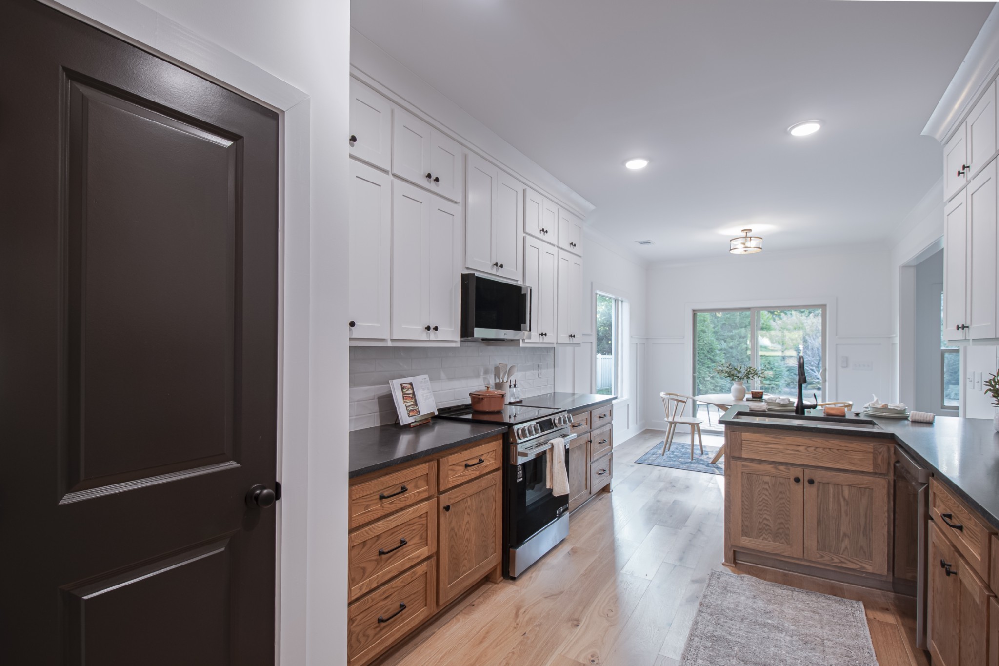 835 Lexington Circle Manchester, TN 37355 - Photo 21 of 53 a kitchen with stainless steel appliances granite countertop a stove a sink and a refrigerator