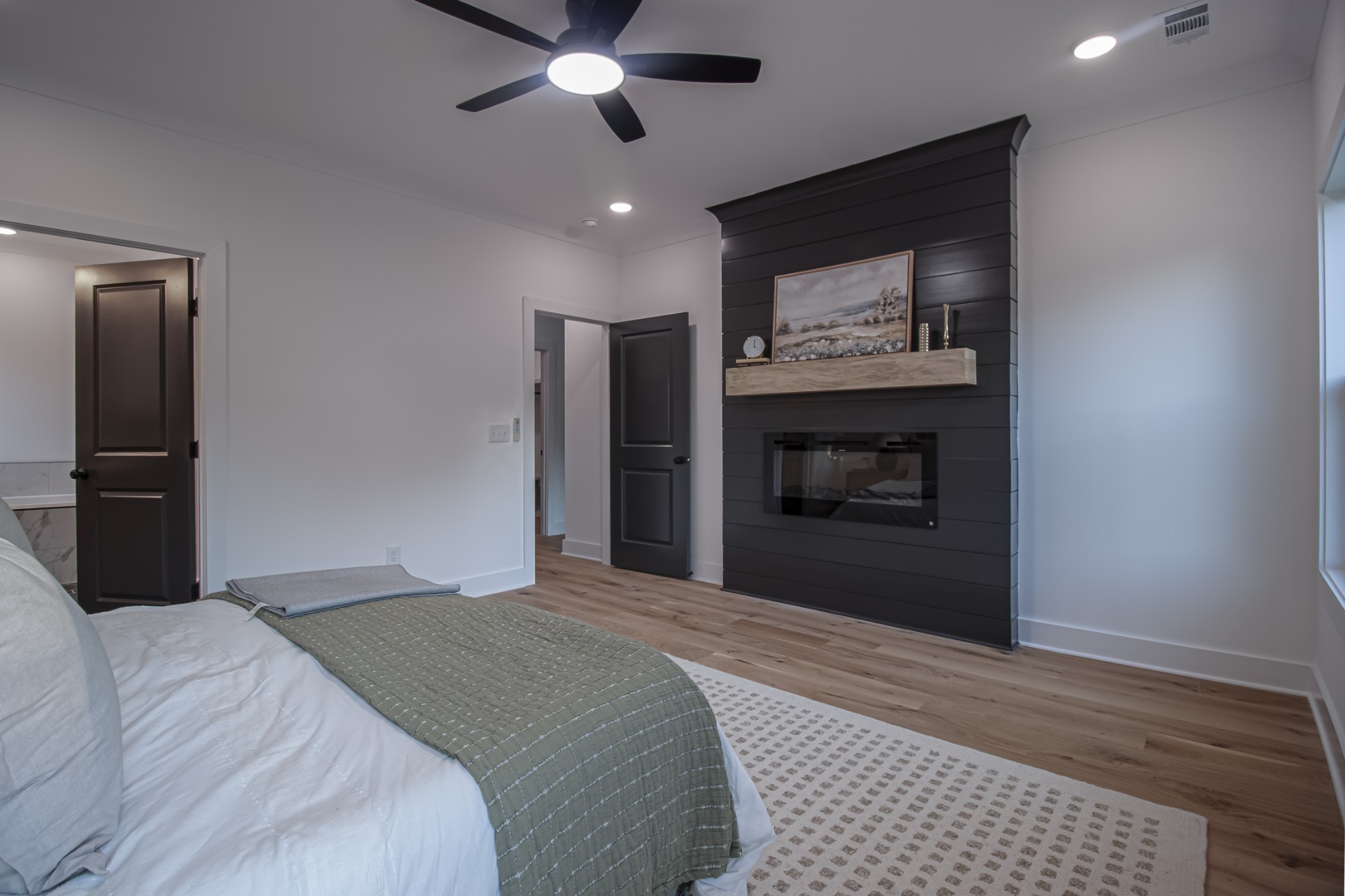 835 Lexington Circle Manchester, TN 37355 - Photo 29 of 53 a bedroom with a bed and a fireplace