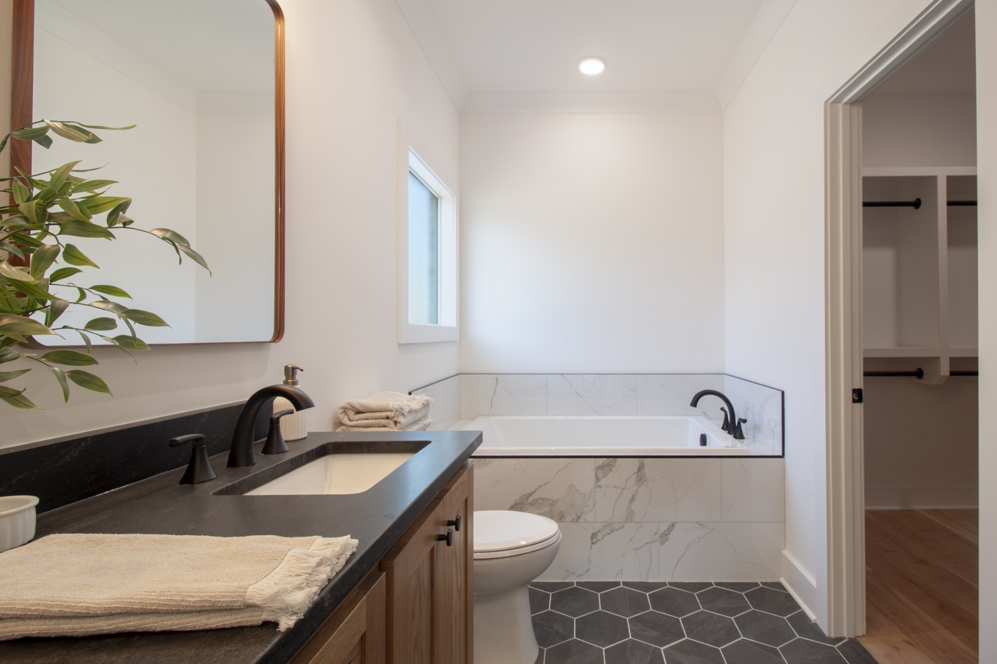 835 Lexington Circle Manchester, TN 37355 - Photo 32 of 53 a bathroom with a granite countertop sink and a bathtub