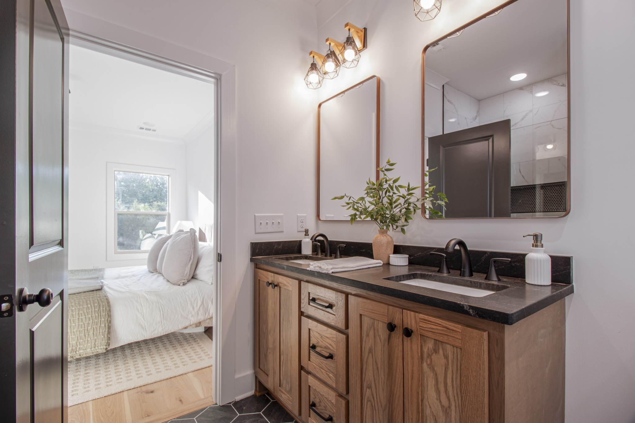 835 Lexington Circle Manchester, TN 37355 - Photo 38 of 53 a bathroom with a double vanity sink and mirror