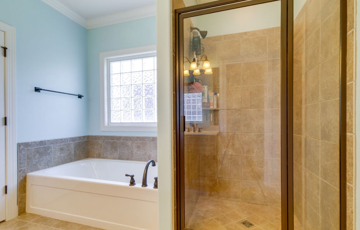 3103 Sakari Circle Spring Hill, TN 37174 - Photo 10 of 18 a bathroom with a bathtub and shower