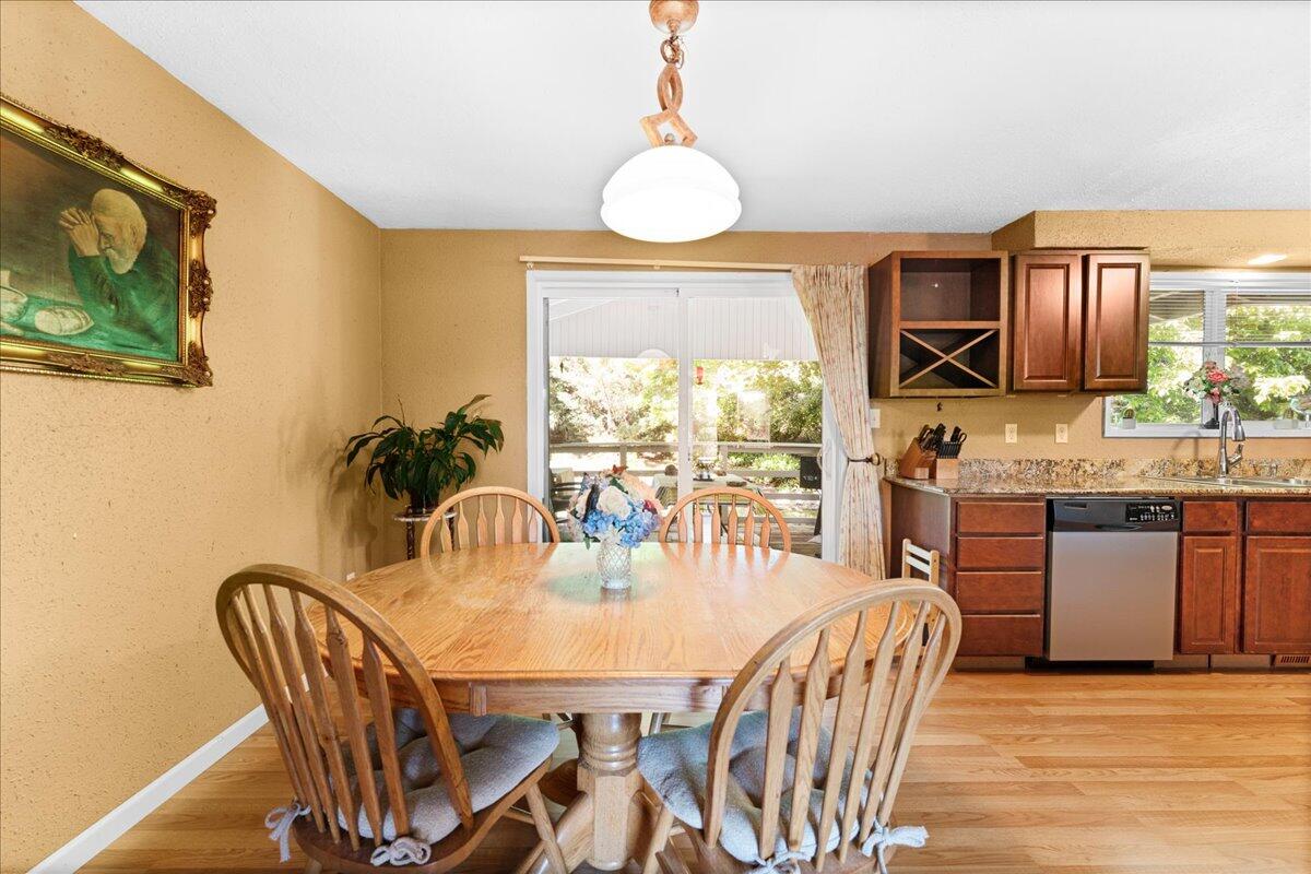 4093 Old Upton Road Central Point, OR 97502 - Photo 8 of 23 a dining room with furniture a window and a chandelier