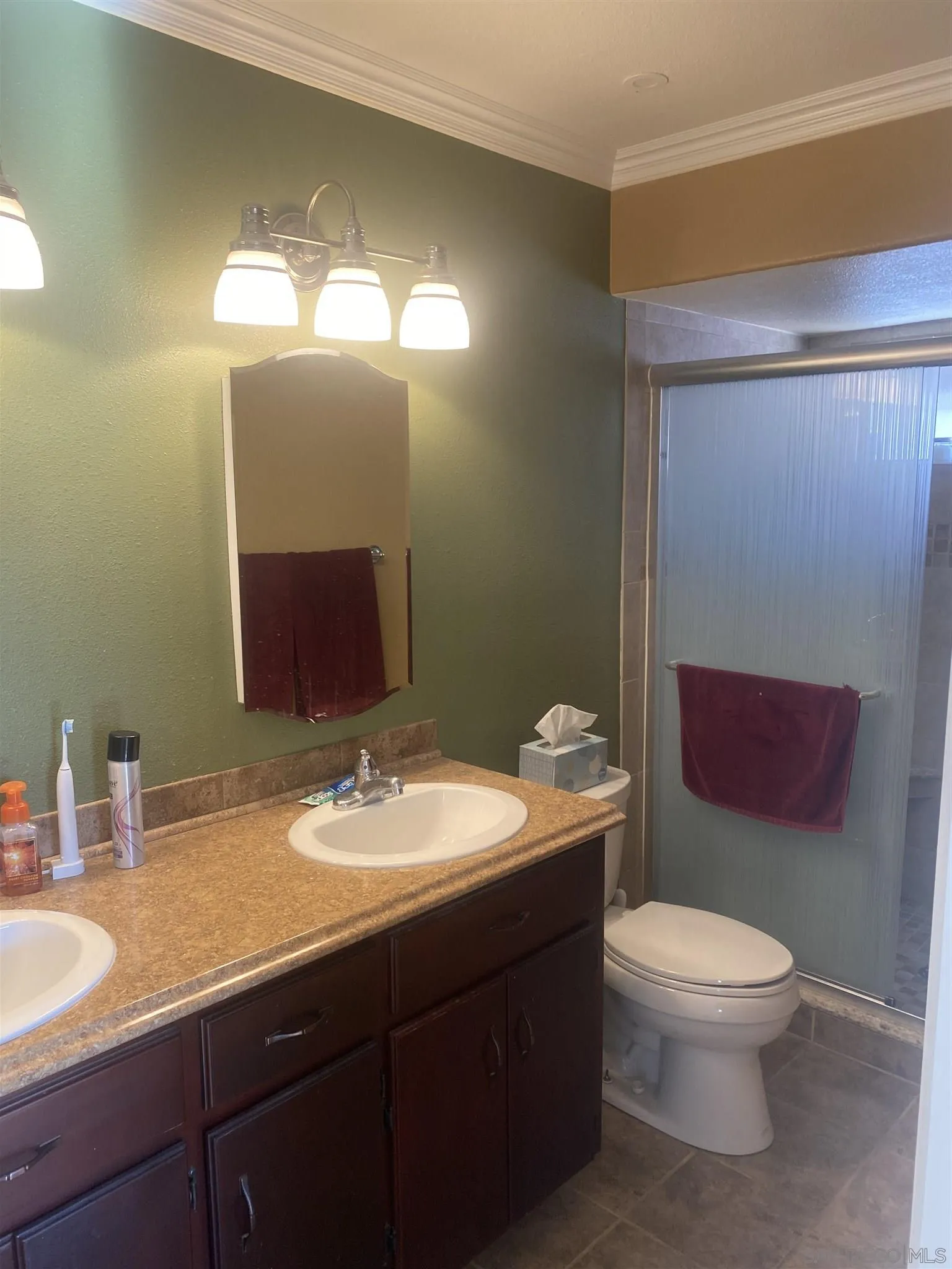 10991 Hillcreek Road Santee, CA 92071 - Photo 17 of 26 a bathroom with a toilet sink and mirror