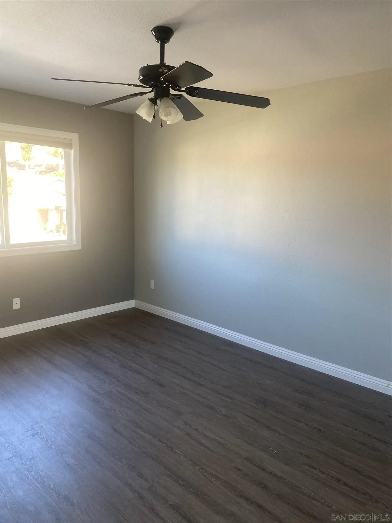 10991 Hillcreek Road Santee, CA 92071 - Photo 19 of 26 a view of a room with wooden floor and windows