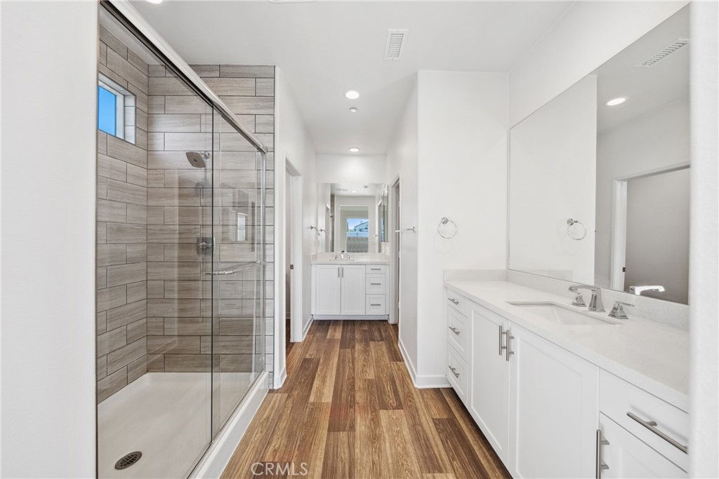 45037 Via Vela Temecula, CA 92592 - Photo 12 of 38 a bathroom with a double vanity sink and mirror