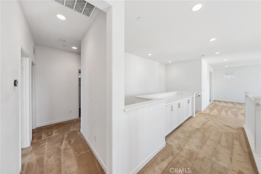 45037 Via Vela Temecula, CA 92592 - Photo 19 of 38 a view of a hallway to an empty room