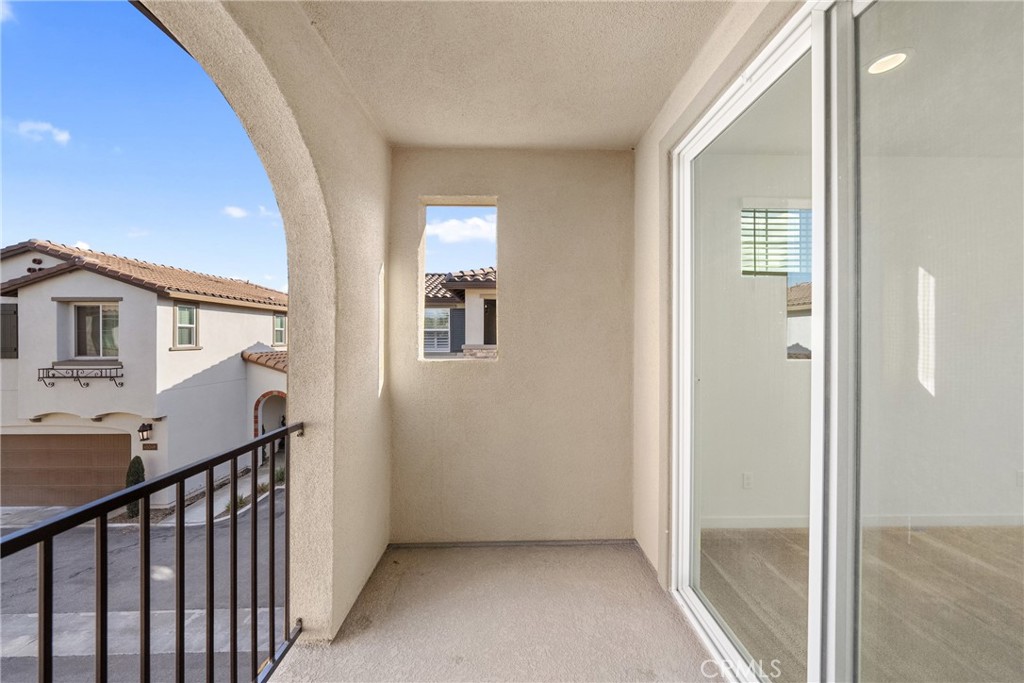 45037 Via Vela Temecula, CA 92592 - Photo 21 of 38 a view of a hallway with windows and stairs