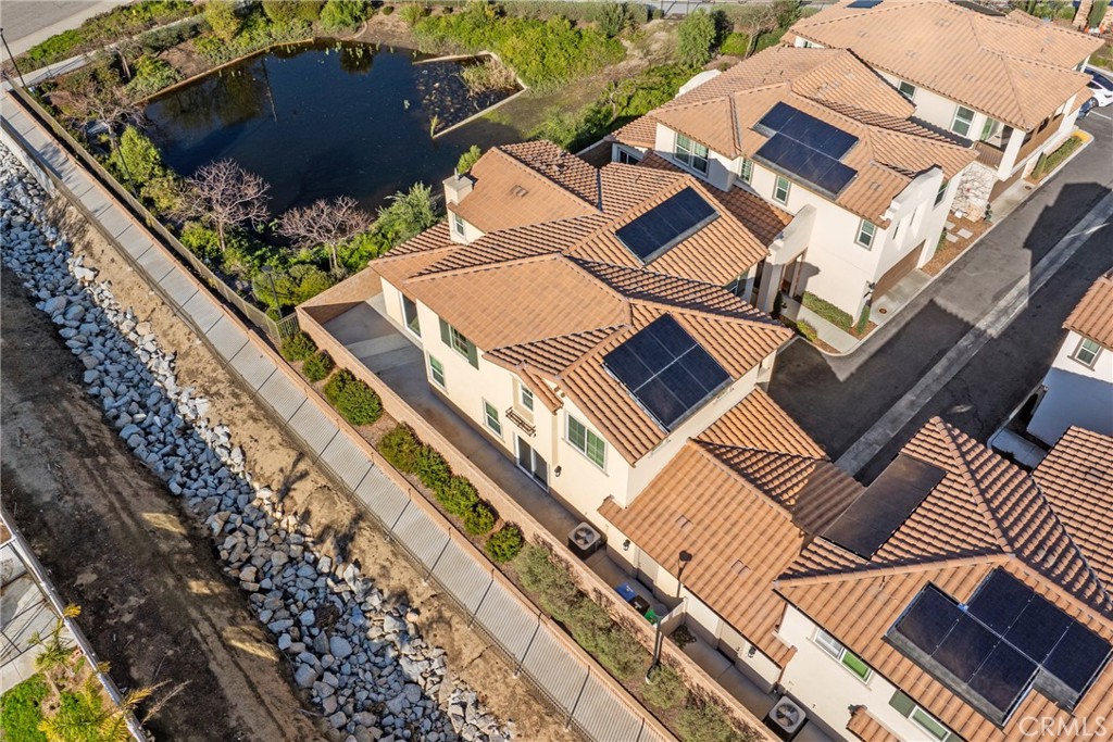 45037 Via Vela Temecula, CA 92592 - Photo 34 of 38 an aerial view of a residential apartment building with a yard
