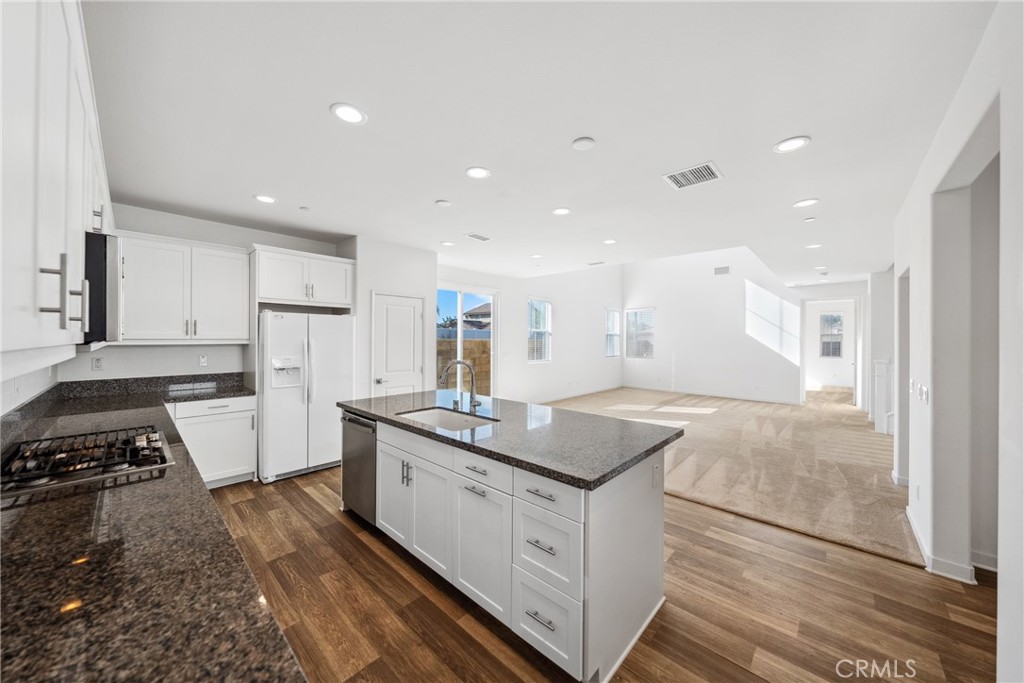 45037 Via Vela Temecula, CA 92592 - Photo 8 of 38 a kitchen with sink stove and refrigerator