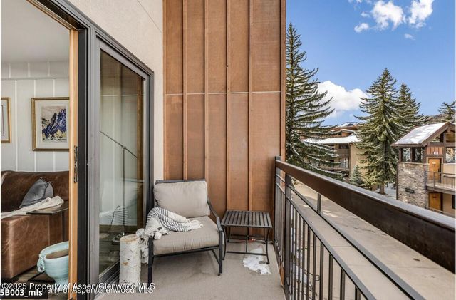 a view of balcony with furniture