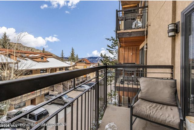 a view of balcony with furniture