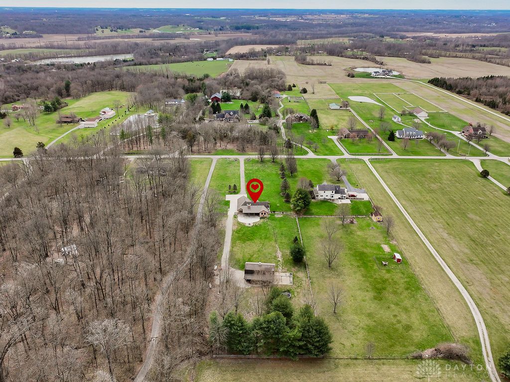 7400 Cook-Jones Road Waynesville, OH 45068 - Photo 10 of 72 An aerial view showcases a peaceful rural landscape with lush fields and scattered homes.