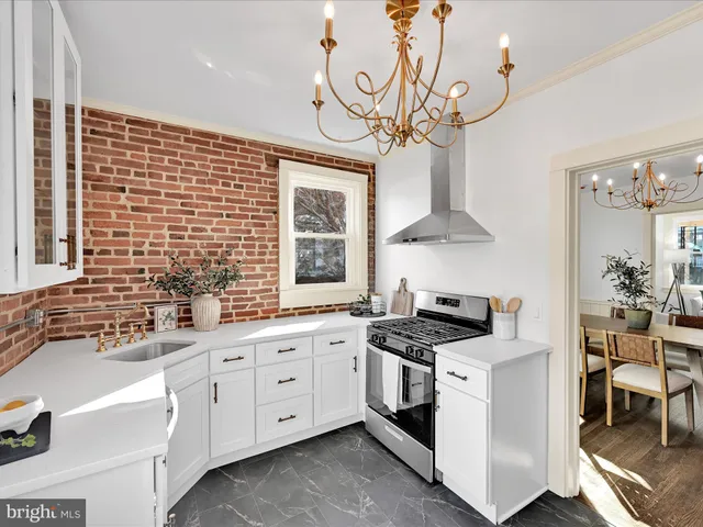 a kitchen that has a lot of cabinets in it