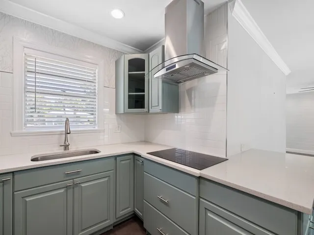 a kitchen with a sink and a window