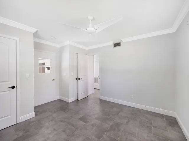 a view of a patio with a table and chairs