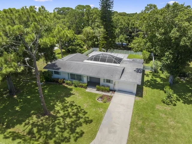 aerial view of a house with a yard