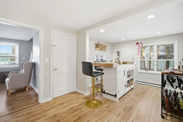 a view of kitchen with cabinets and wooden floor