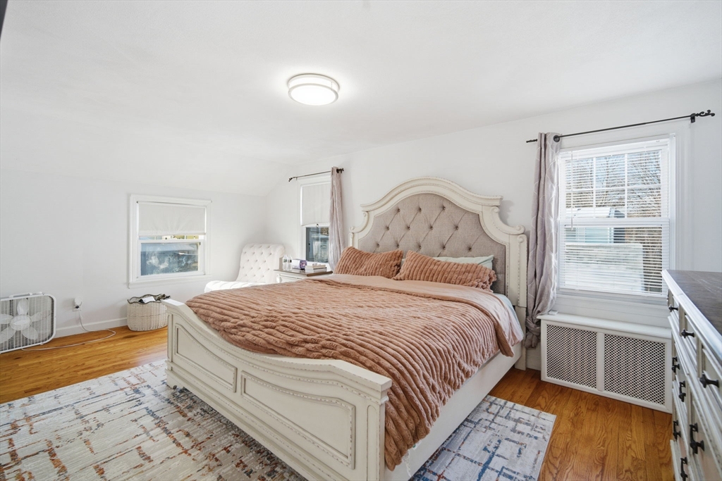 13 Bither Street Springfield, MA 01118 - Photo 14 of 29 a bedroom with a bed and a window