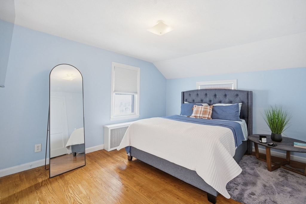 13 Bither Street Springfield, MA 01118 - Photo 18 of 29 a bedroom with a bed and window