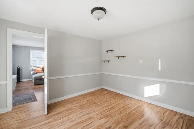 a view of a livingroom with wooden floor