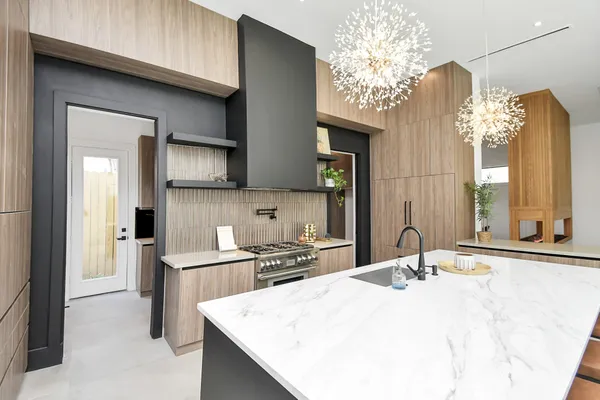 a kitchen with sink stove and cabinets