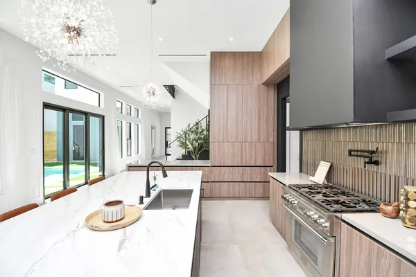 a kitchen with a stove and a refrigerator