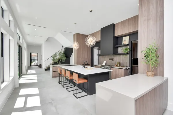 a living room with furniture and large windows