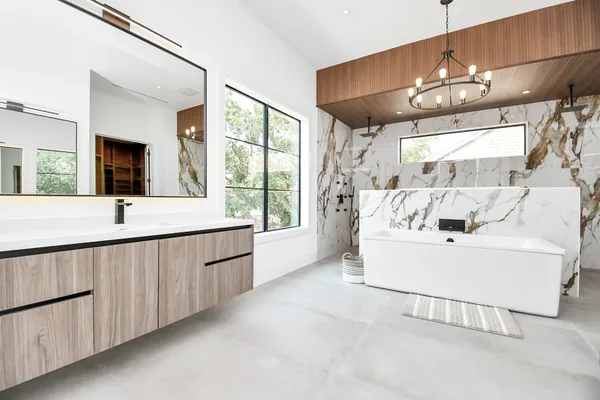 a bathroom with a bathtub and a window