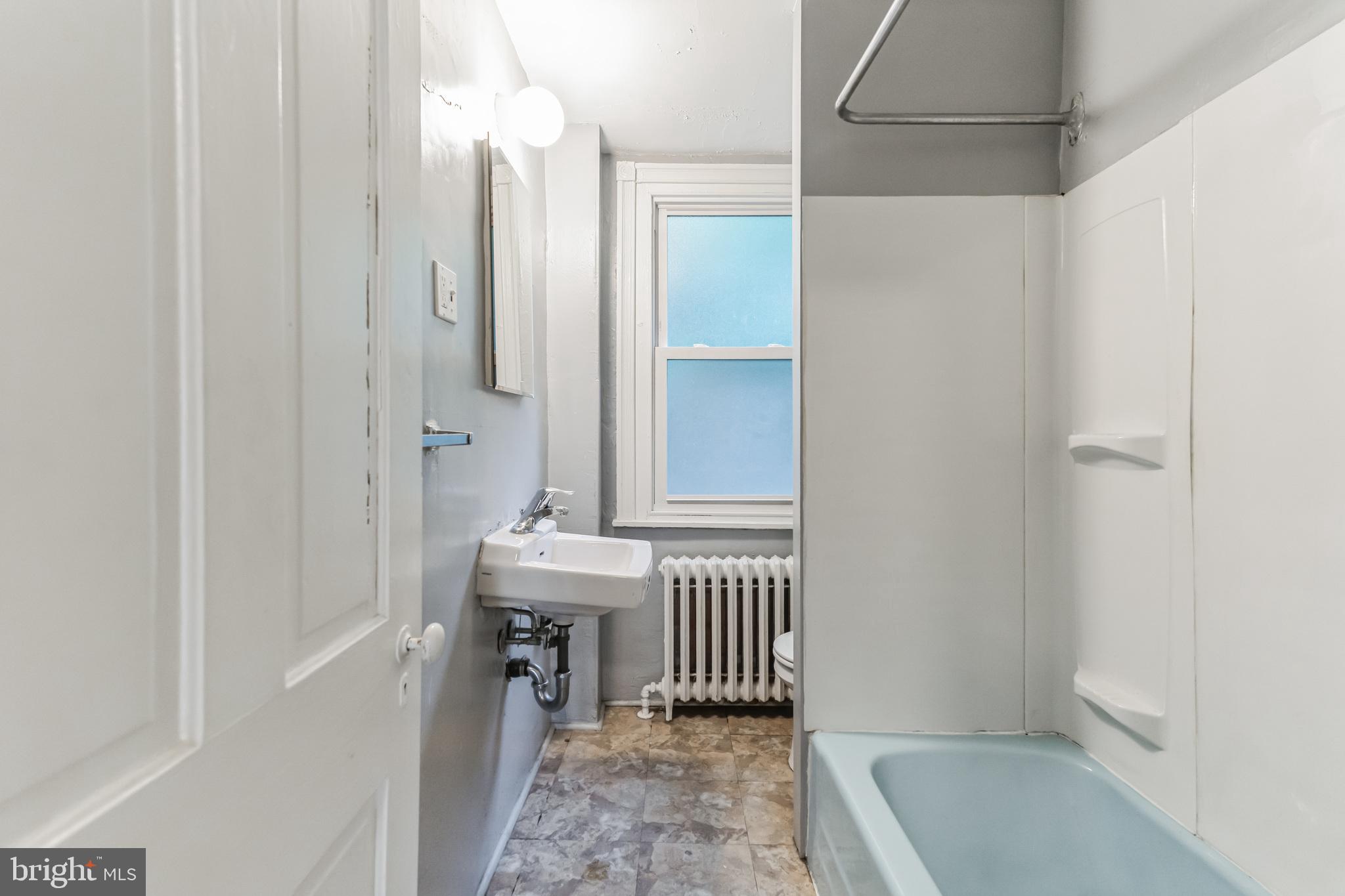 4483 Boone Street Philadelphia, PA 19128 - Photo 13 of 15 a bathroom with a sink and a shower
