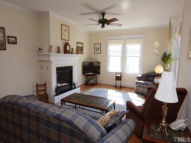103 Georgetown Road Raleigh, NC 27608 - Photo 2 of 12 9' ceilings, hardwood flooring and fireplace with gas logs. Living Room