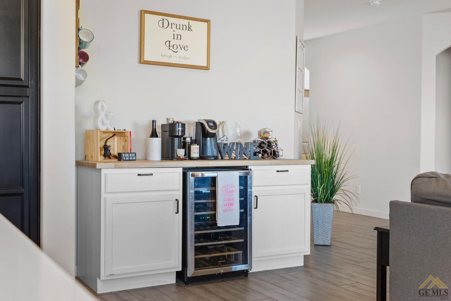Undisclosed Address Bakersfield, CA 93314 - Photo 12 of 44 a room with cabinets and wooden floor