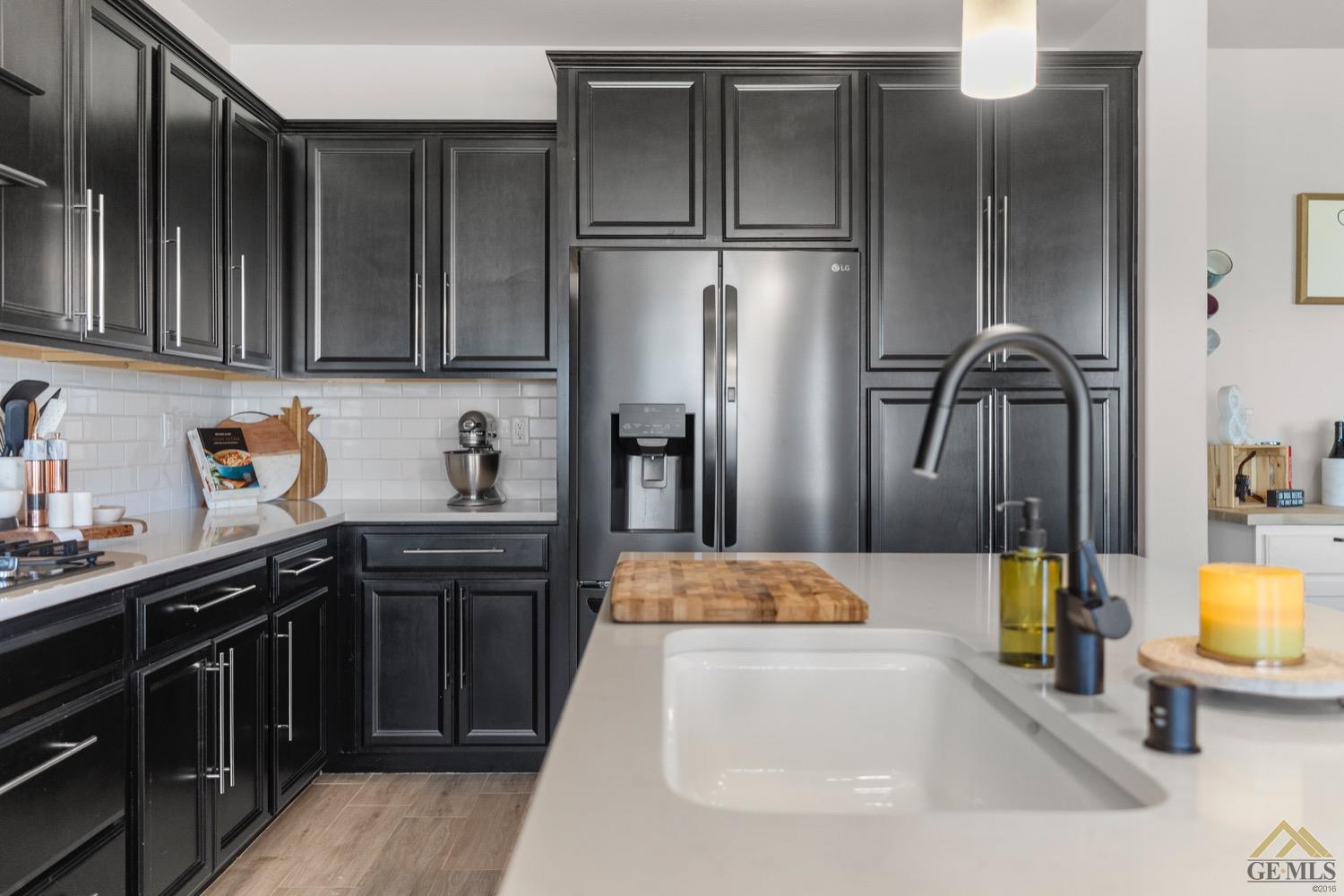 Undisclosed Address Bakersfield, CA 93314 - Photo 22 of 44 a kitchen with stainless steel appliances a refrigerator and a sink