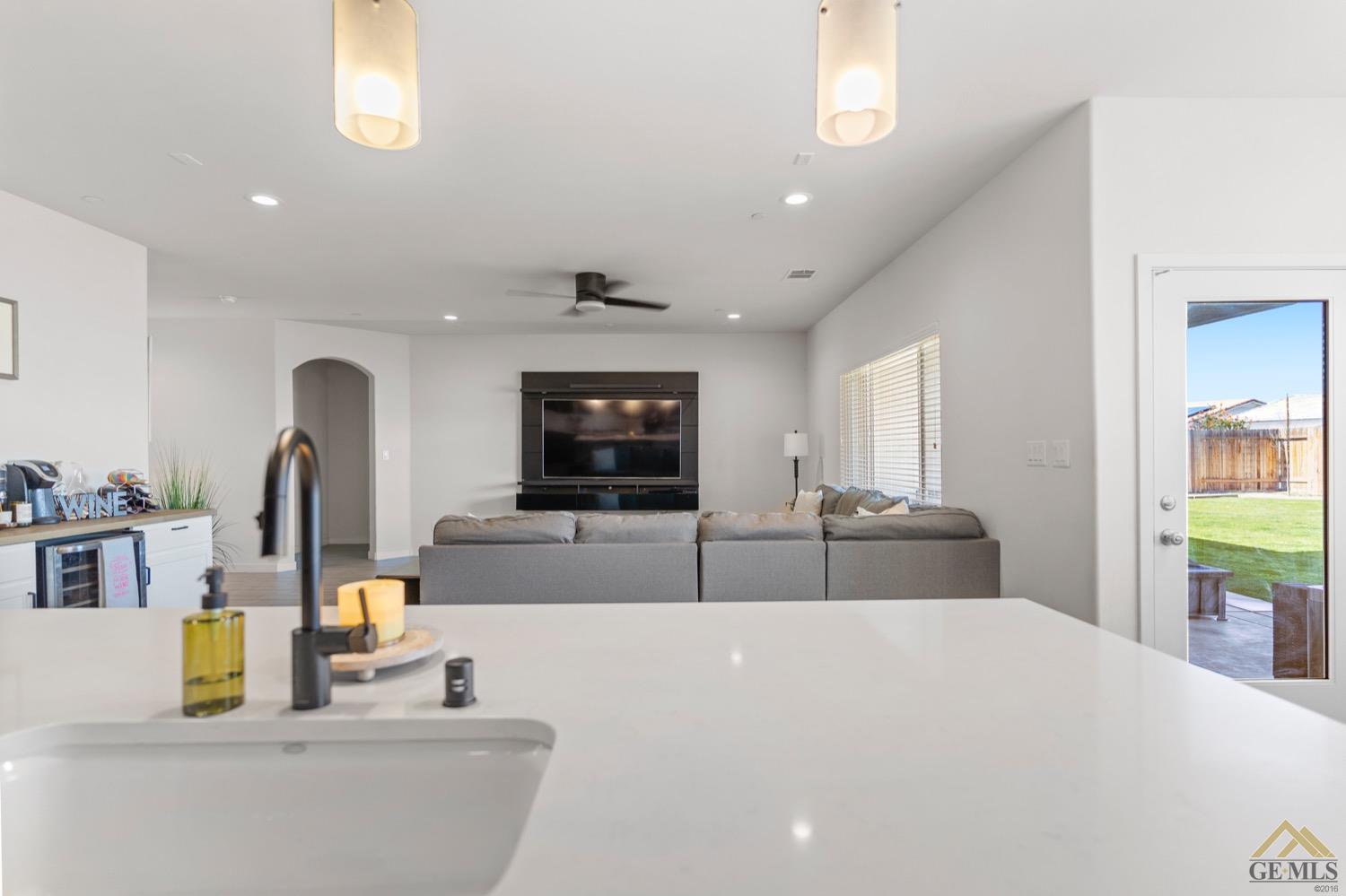 Undisclosed Address Bakersfield, CA 93314 - Photo 23 of 44 a living room with furniture and a flat screen tv