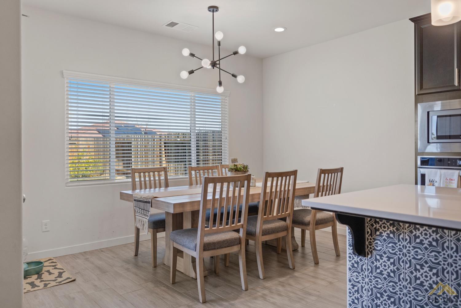 Undisclosed Address Bakersfield, CA 93314 - Photo 26 of 44 a view of a dining room with furniture window and outside view