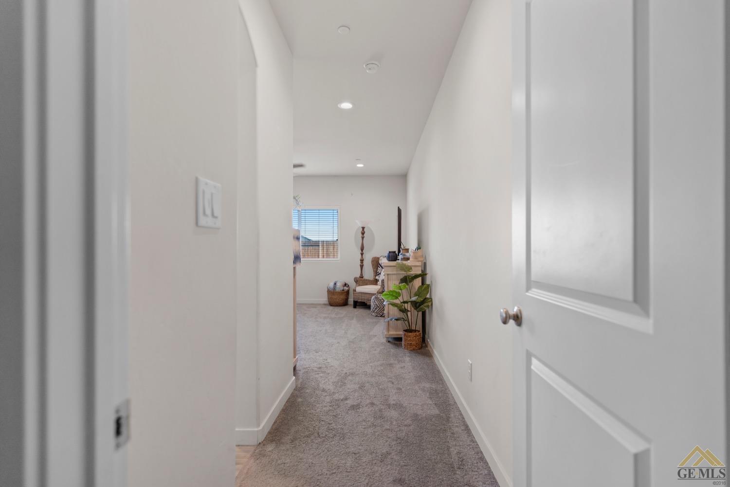 Undisclosed Address Bakersfield, CA 93314 - Photo 27 of 44 a view of hallway with livingroom and a couch
