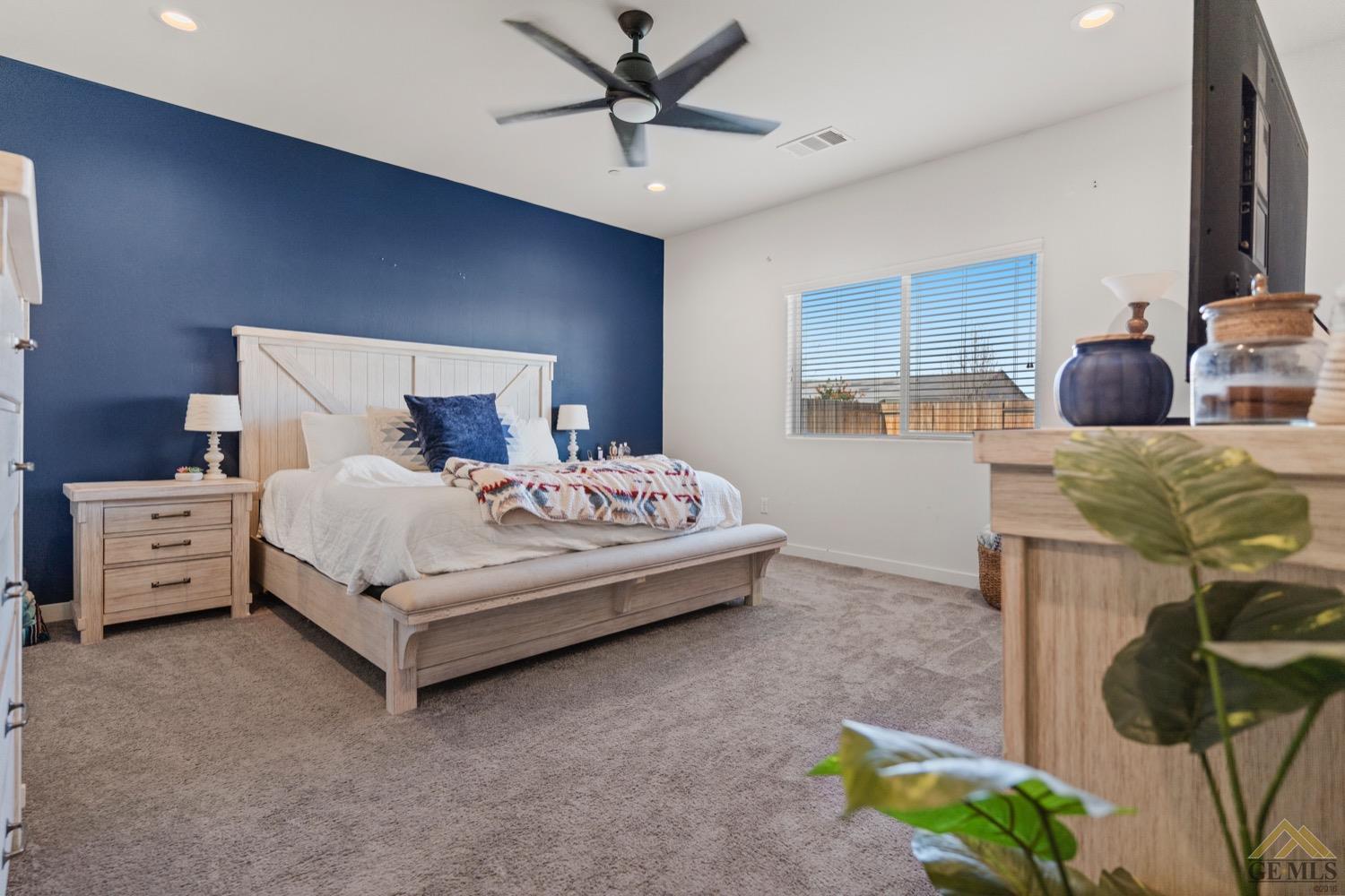 Undisclosed Address Bakersfield, CA 93314 - Photo 28 of 44 a bed room with a bed and a television