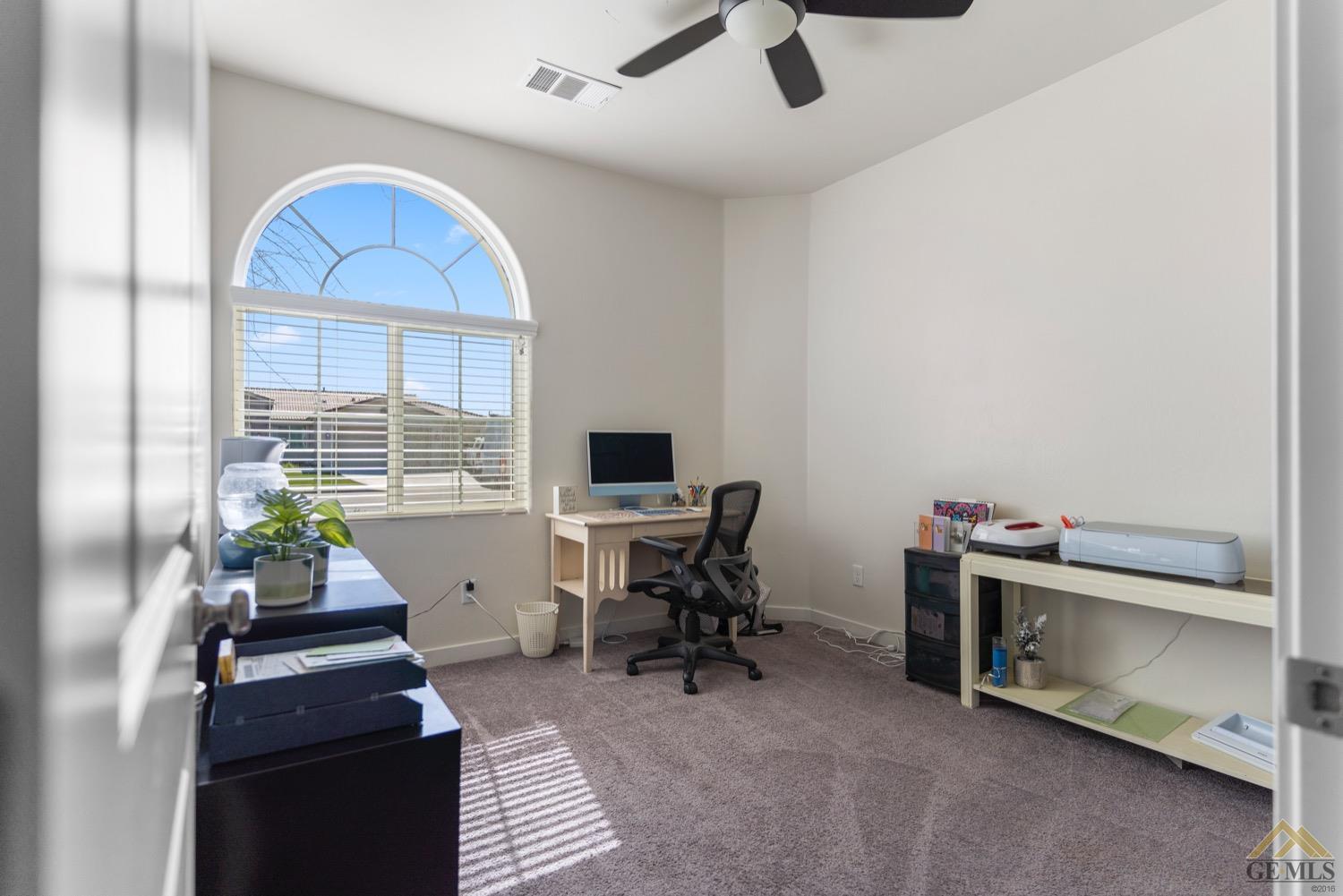 Undisclosed Address Bakersfield, CA 93314 - Photo 38 of 44 a view of a workspace with furniture and a window