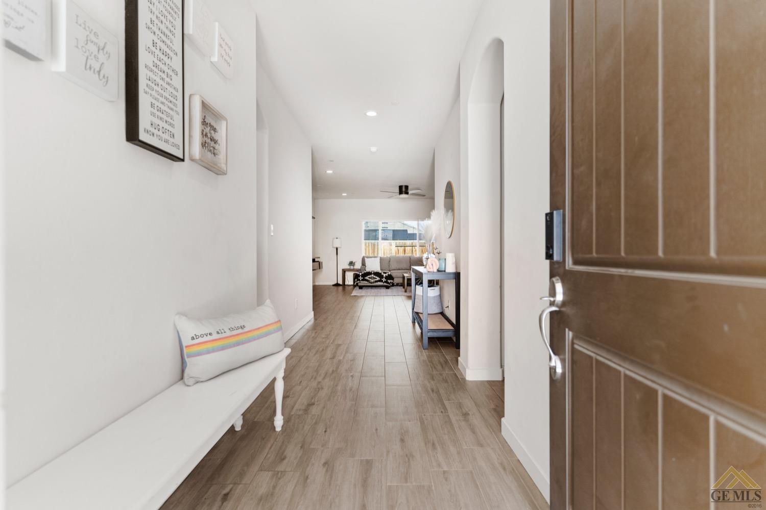 Undisclosed Address Bakersfield, CA 93314 - Photo 4 of 44 a view of living room filled with furniture and wooden floor