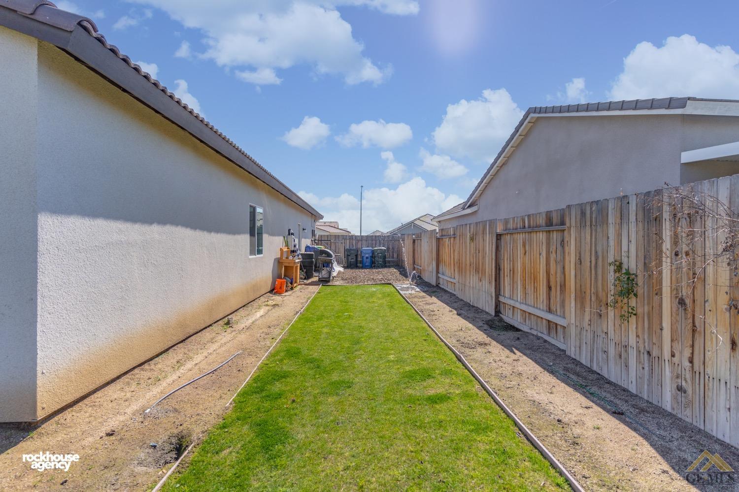 Undisclosed Address Bakersfield, CA 93314 - Photo 43 of 44 a view of a backyard with a garden