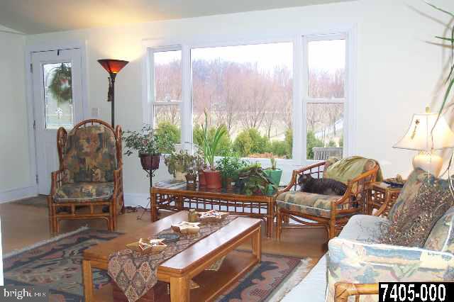 431 Old Westminster Road Hanover, PA 17331 - Photo 8 of 9 a living room with furniture and a large window