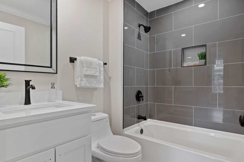 1 Overlook Road Wakefield, MA 01880 - Photo 11 of 15 a bathroom with a bathtub shower sink vanity and toilet