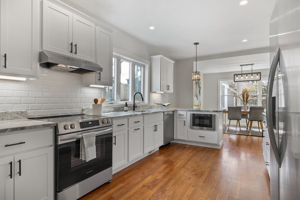 1 Overlook Road Wakefield, MA 01880 - Photo 6 of 15 a kitchen with a stove a sink and white cabinets