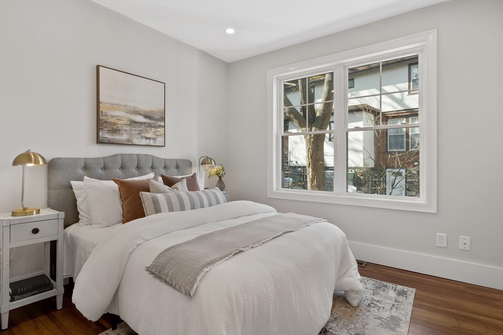 1 Overlook Road Wakefield, MA 01880 - Photo 8 of 15 a large bed sitting in a bedroom next to a window