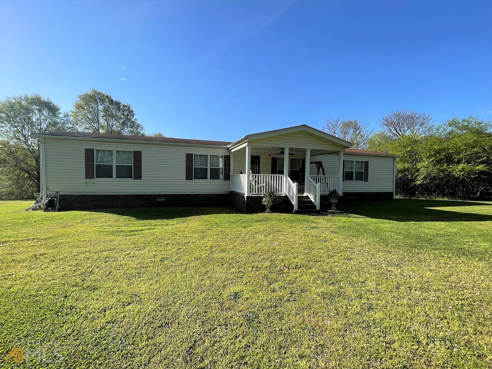 2038 Hewell Road Dewy Rose, GA 30634 - Photo 1 of 1 a front view of a house with garden