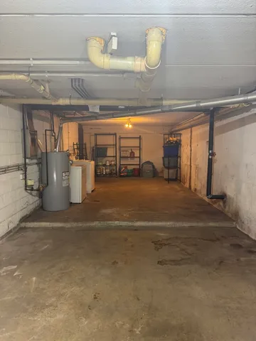 a view of a kitchen with a sink and chandelier