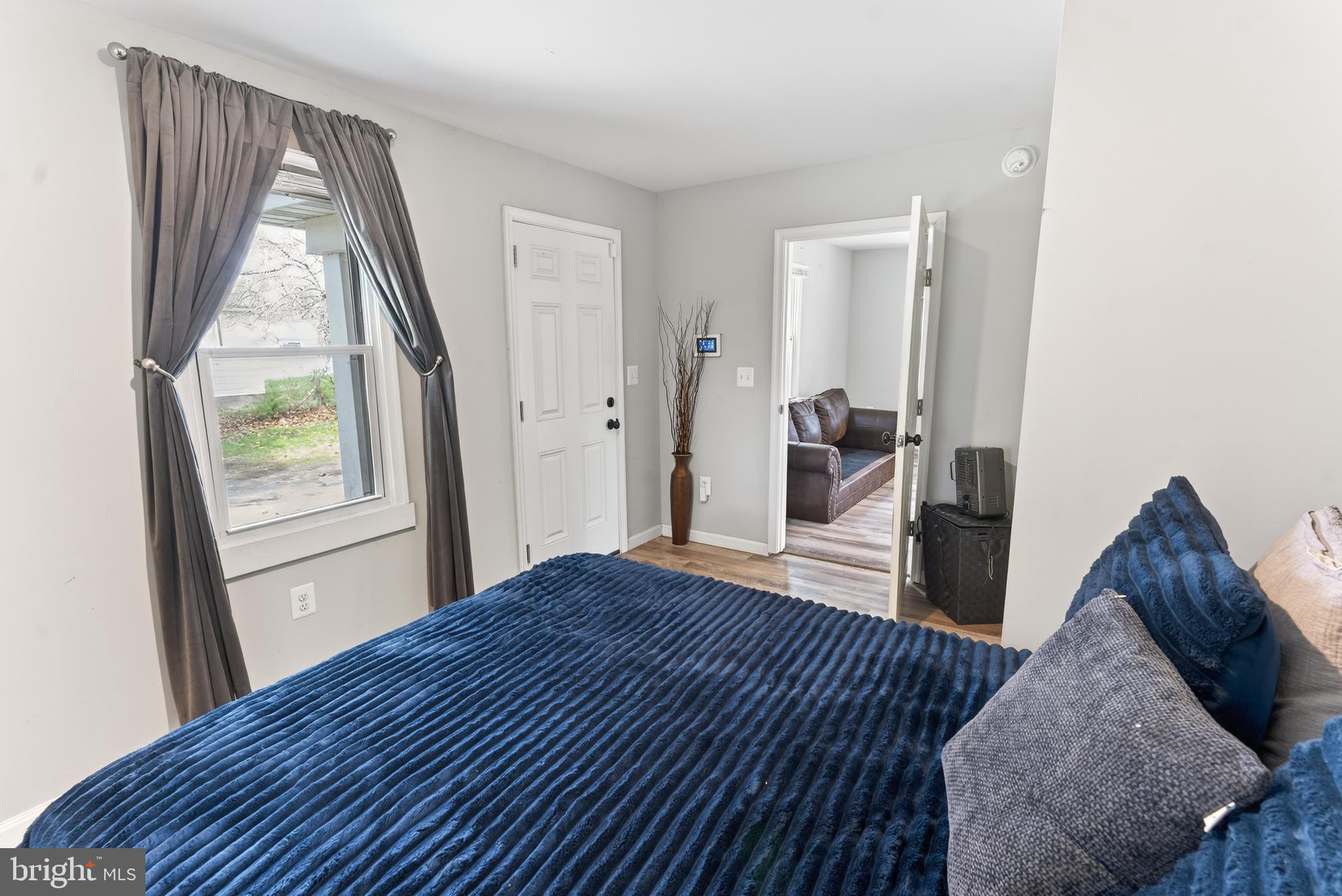 1002 West Main Street Salisbury, MD 21801 - Photo 12 of 31 a bedroom with a bed and a large window