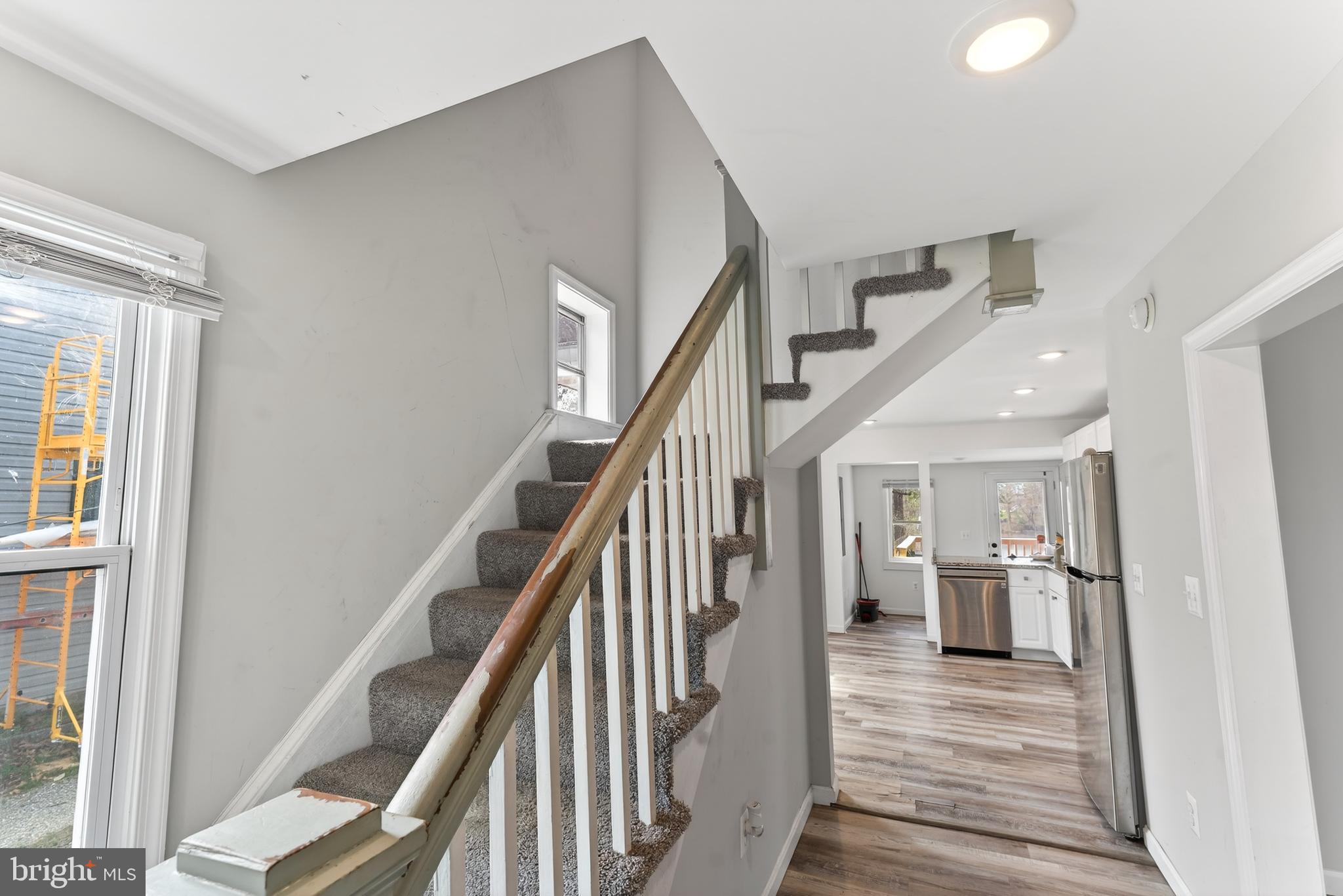 1002 West Main Street Salisbury, MD 21801 - Photo 15 of 31 a view of a hallway with wooden floor and staircase