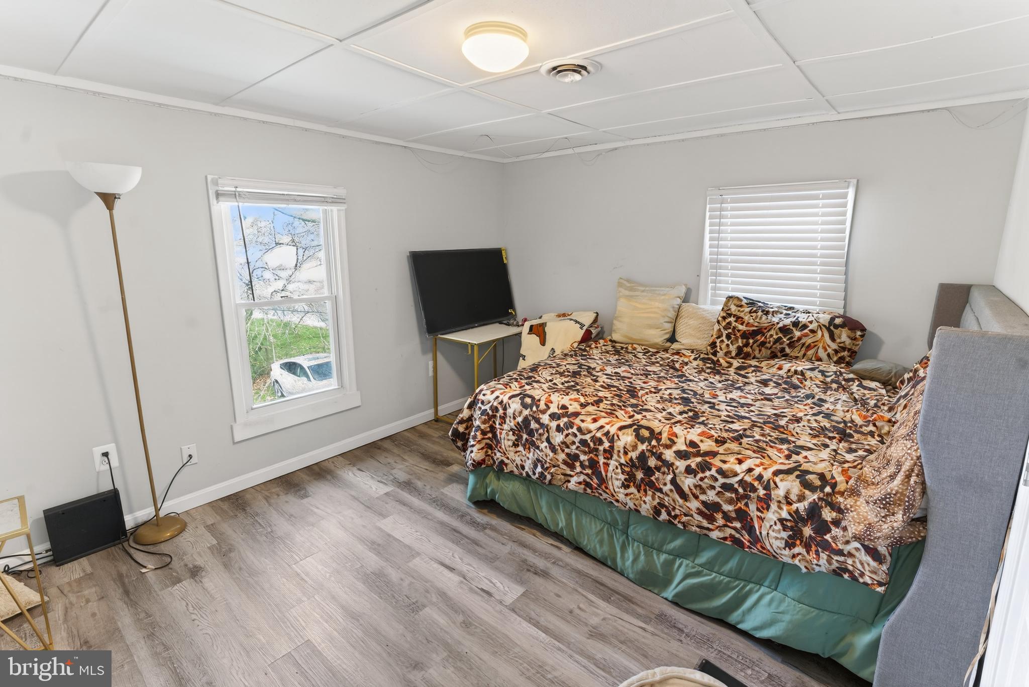 1002 West Main Street Salisbury, MD 21801 - Photo 24 of 31 a bed sitting in a spacious bedroom next to a window