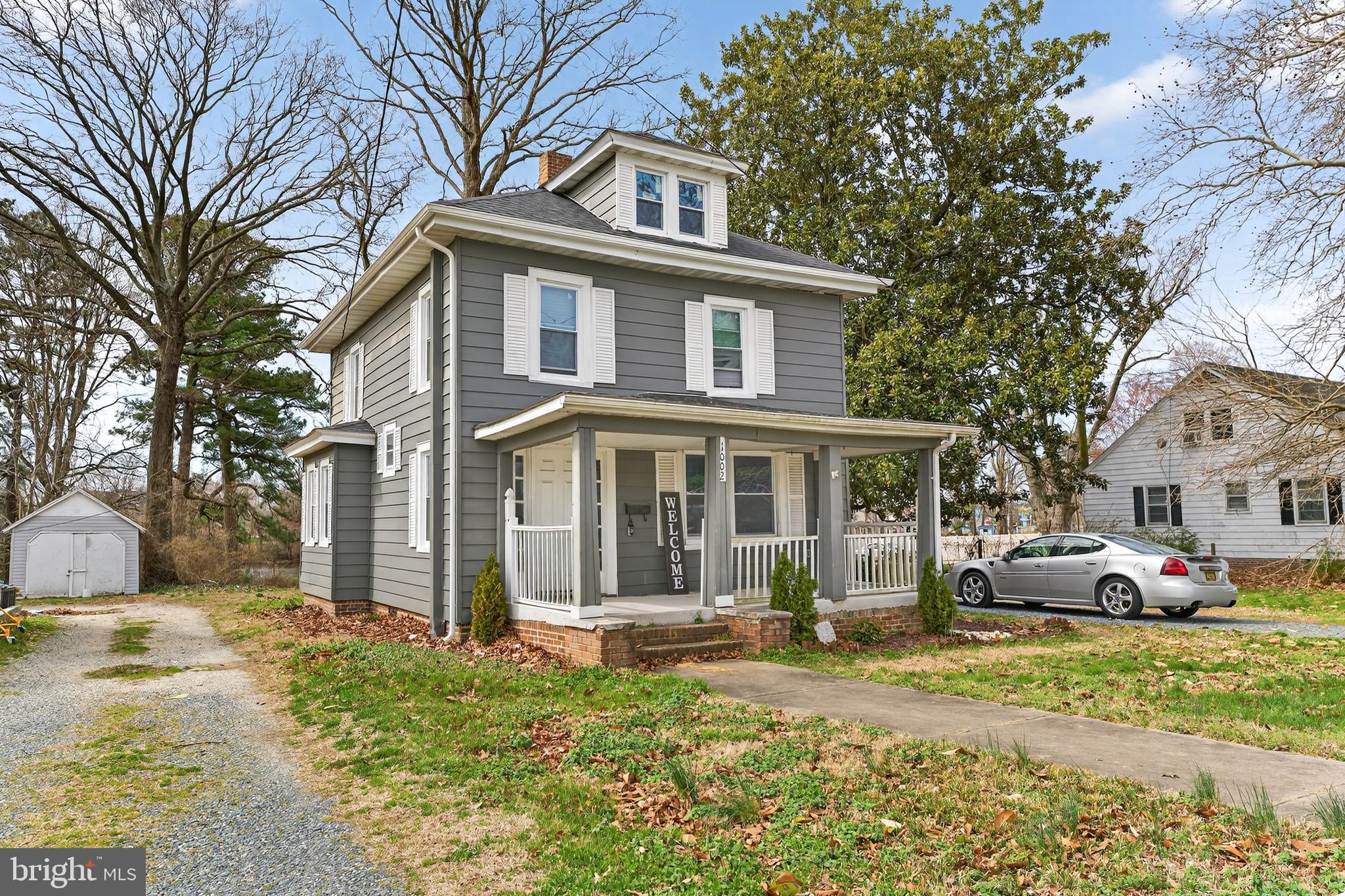 1002 West Main Street Salisbury, MD 21801 - Photo 3 of 31 a front view of a house with cars parked