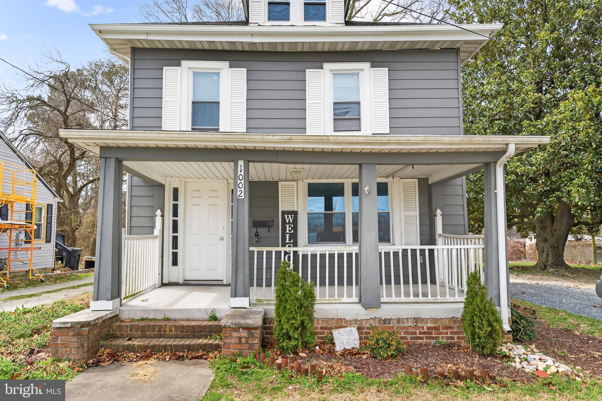 1002 West Main Street Salisbury, MD 21801 - Photo 7 of 31 a front view of a house with a porch